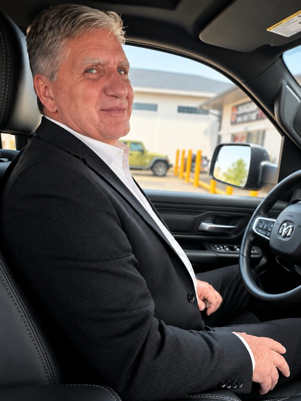 Barry Porter, owner-operator of Covenant Earth Works, seated in the cab of his truck